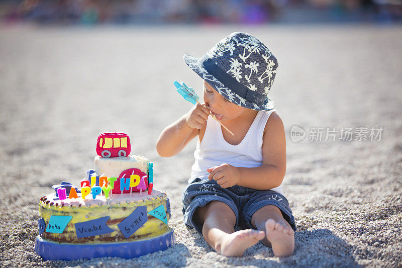 Sweet boys, celebrating on the beach birthday with car theme cake and decoration